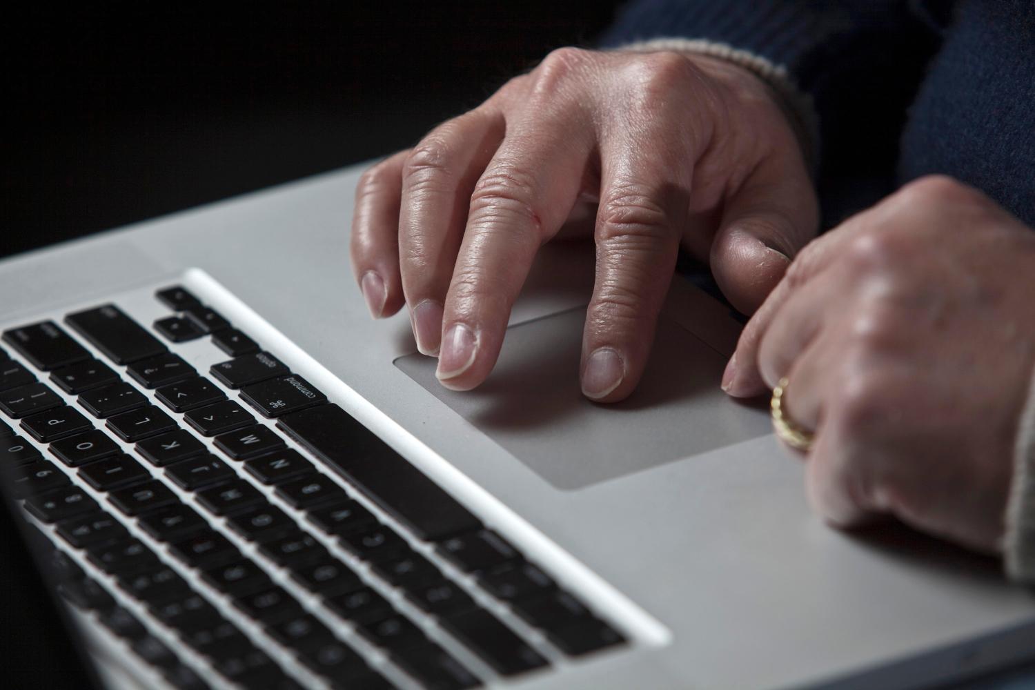 John Bumgarner, a cyber warfare expert who is chief technology officer of the U.S. Cyber Consequences Unit, a non-profit group that studies the impact of cyber threats, works on his laptop computer during a portrait session in Charlotte, North Carolina December 1, 2011. A cyber warfare expert claims he has linked the Stuxnet computer virus that attacked Iran's nuclear program in 2010 to Conficker, a mysterious worm that surfaced in late 2008 and infected millions of PCs. Conficker was used to open back doors into computers in Iran, then infect them with Stuxnet, according to research Bumgarner, a retired U.S. Army special-operations veteran and former intelligence officer.  To match Insight - CYBERSECURITY/IRAN     REUTERS/John Adkisson    (UNITED STATES - Tags: SCIENCE TECHNOLOGY MILITARY)