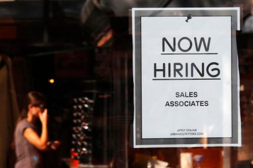 A "Now Hiring" sign hangs on the door to the Urban Outfitters store at Quincy Market in Boston, Massachusetts September 5, 2014. U.S. employers hired the fewest number of workers in eight months in August and more Americans gave up the hunt for jobs, providing a cautious Federal Reserve with more reasons to wait longer before raising interest rates.  Nonfarm payrolls increased 142,000 last month after expanding by 212,000 in July, the Labor Department said on Friday. The jobless rate fell one-tenth of a percentage point to 6.1 percent, partly because people dropped out of the labor force.    REUTERS/Brian Snyder   (UNITED STATES - Tags: BUSINESS EMPLOYMENT)