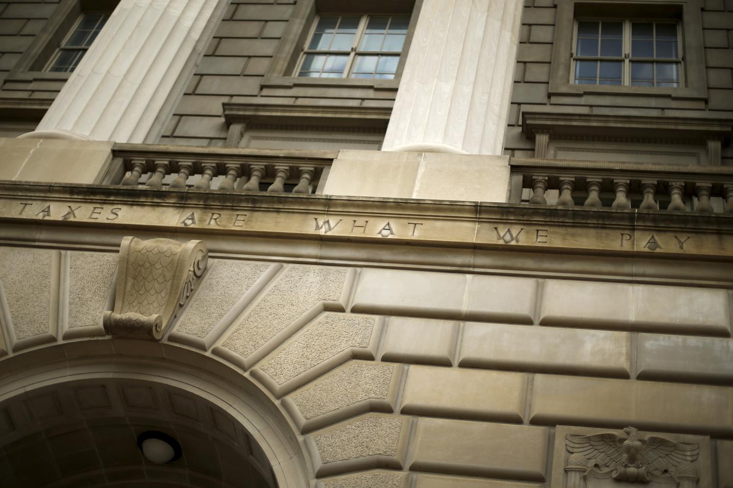 A general view of the U.S. Internal Revenue Service (IRS) building, with the partial quote "taxes are what we pay," in Washington May 27, 2015. Tax return information for about 100,000 U.S. taxpayers was illegally accessed by cyber criminals over the past four months, U.S. IRS Commissioner John Koskinen said on Tuesday, the latest in a series of data thefts that have alarmed American consumers. The entire quote chiseled on the building, from Oliver Wendell Holmes, reads, "Taxes are what we pay for a civilized society''. REUTERS/Jonathan Ernst