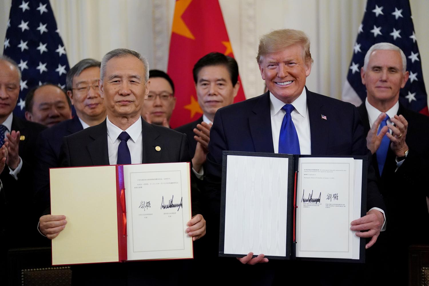 U.S. President Donald Trump stands Chinese Vice Premier Liu He after signing "phase one" of the U.S.-China trade agreement in the East Room of the White House in Washington, U.S., January 15, 2020. REUTERS/Kevin Lamarque TPX IMAGES OF THE DAY