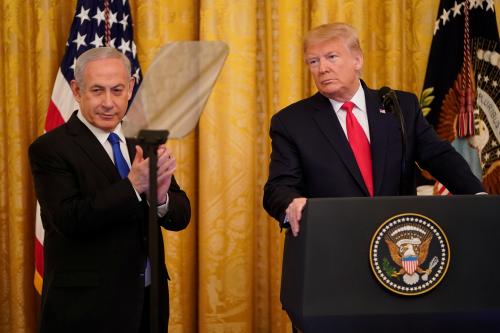 Israel's Prime Minister Benjamin Netanyahu applauds as he and U.S. President Donald Trump deliver joint remarks on a Middle East peace plan proposal in the East Room of the White House in Washington, U.S., January 28, 2020. REUTERS/Joshua Roberts 