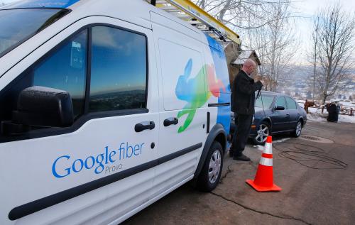 A technician gets cabling out of his truck to install Google Fiber in a residential home in Provo, Utah, January 2, 2014. Provo is one of three cities Google is currently building and installing gigabit internet and television service for business and residential use.  REUTERS/George Frey (UNITED STATES - Tags: BUSINESS TELECOMS)
