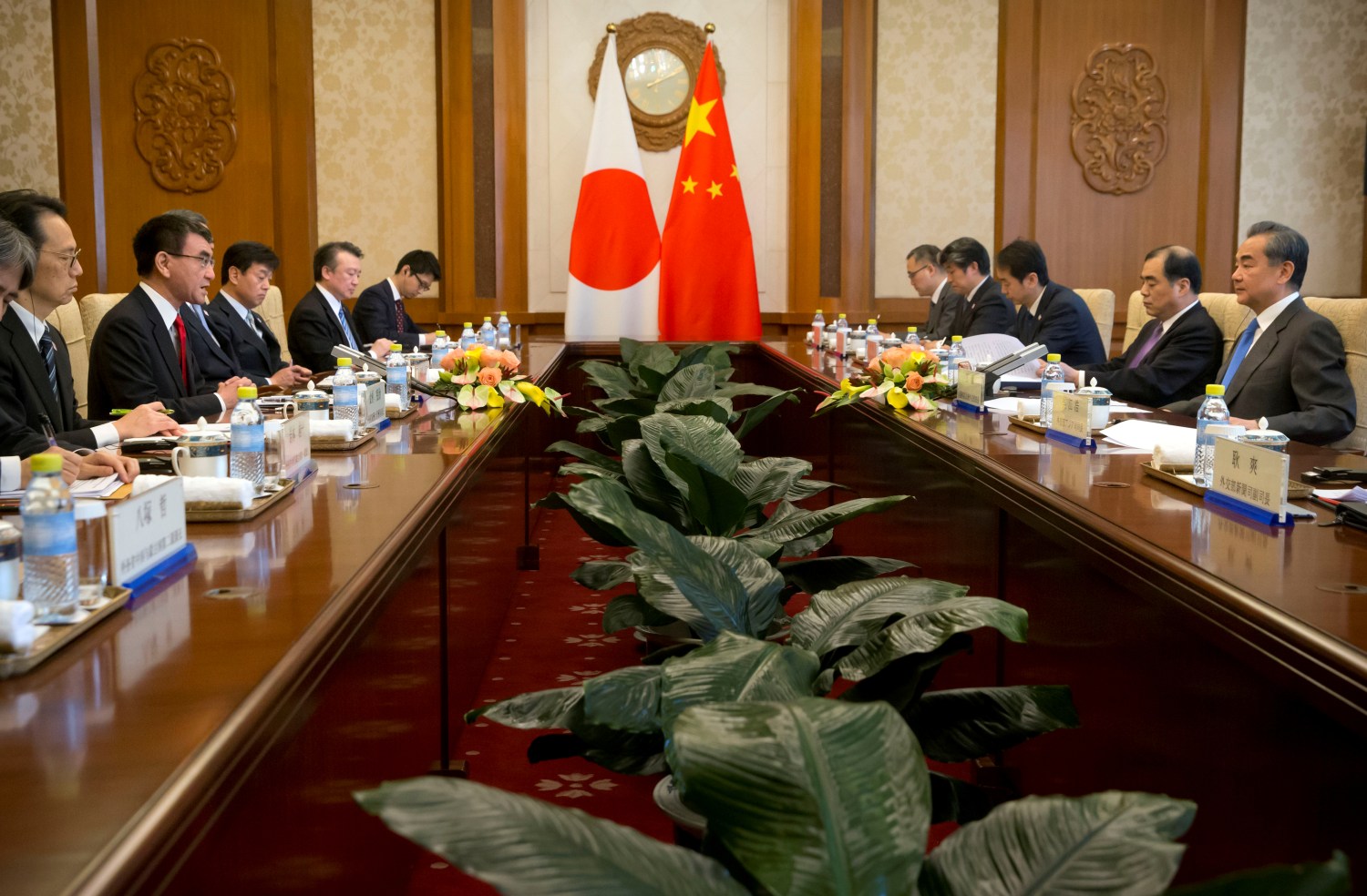 Japanese Foreign Minister Taro Kono (2nd L) talks during a meeting with Chinese Foreign Minister Wang Yi (R) at the Diaoyutai State Guesthouse in Beijing, China April 15, 2019. Mark Schiefelbein/Pool via REUTERS
