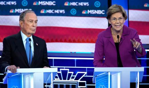 Senator Elizabeth Warren speaks as former New York City Mayor Michael Bloomberg listens during the ninth Democratic 2020 U.S. Presidential candidates debate at the Paris Theater in Las Vegas Nevada, U.S., February 19, 2020. REUTERS/Mike Blake