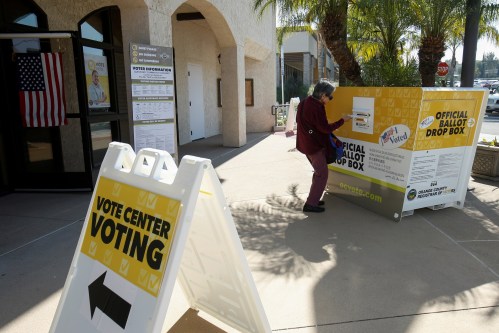 A voter places her ballot at an early voting location in the March 3 Super Tuesday primary in Laguna Woods, California, U.S., February 24, 2020. Picture taken February 24, 2020.      REUTERS/Mike Blake