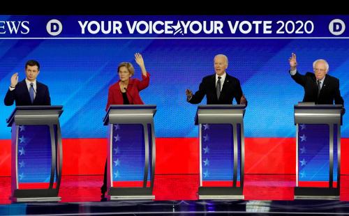 FILE PHOTO: Democratic 2020 U.S. presidential candidates former South Bend Mayor Pete Buttigieg, Senator Elizabeth Warren, former Vice President Joe Biden and Senator Bernie Sanders participate in the eighth Democratic 2020 presidential debate at Saint Anselm College in Manchester, New Hampshire, U.S., February 7, 2020. REUTERS/Brian Snyder/File Photo