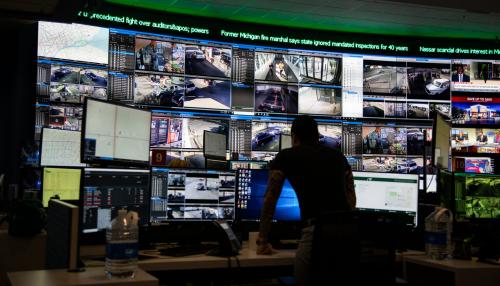 The Detroit Free Press takes a look at the preparedness, in light of mass shootings, of the Detroit Police department's Crime Intel Unit Friday, Aug. 9, 2019, which does counter terrorism threat assessments. A crime analyst looks over several different surveillance cameras positioned around Detroit.Detroitpolice 080919 01 Mw