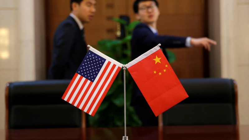 Chinese and U.S. flags are set up for a signing ceremony during a visit by U.S. Secretary of Transportation Elaine Chao at China's Ministry of Transport in Beijing, China April 27, 2018. Picture taken April 27, 2018. REUTERS/Jason Lee - RC13D78E0020