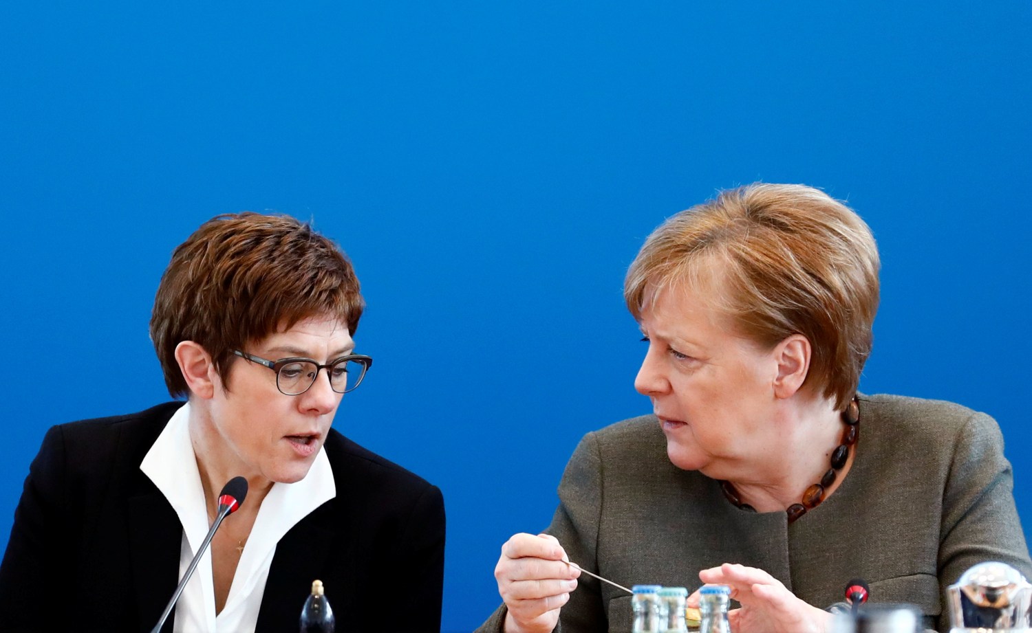 German Chancellor Angela Merkel and German Defense Minister Annegret Kramp-Karrenbauer speak during a CDU board meeting at the party's headquarters in Berlin, Germany, February 24, 2020. REUTERS/Michele Tantussi