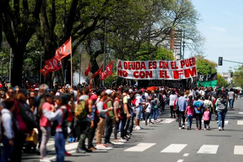 Demonstrators march during a protest against the austerity measures mandated by the IMF during President Mauricio Macri's administration, in Buenos Aires, Argentina October 31, 2019. The banner reads: "The debt is to the people, not to the IMF." REUTERS/Agustin Marcarian