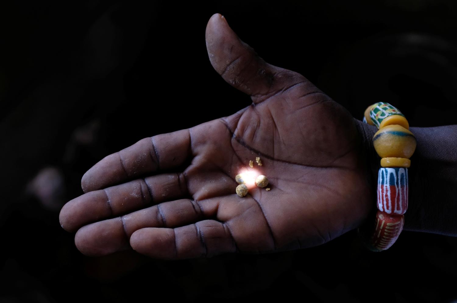 A person holds gold recovered at the end of the informal gold mining process, after the mercury has been burned off, in Bawdie, Ghana, April 4, 2019. Picture taken April 4, 2019.    To match Special Report GOLD-AFRICA/POISON     REUTERS/Francis Kokoroko