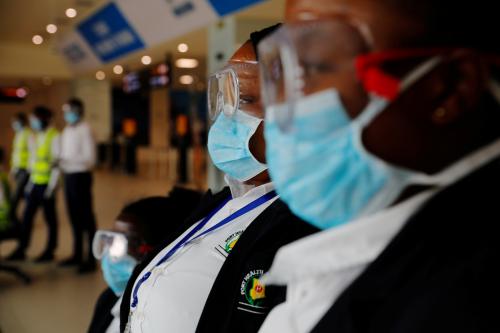 FILE PHOTO: Health workers waits to screen travellers for signs of the coronavirus at the Kotoka International Airport in Accra, Ghana January 30, 2020. REUTERS/Francis Kokoroko/File Photo