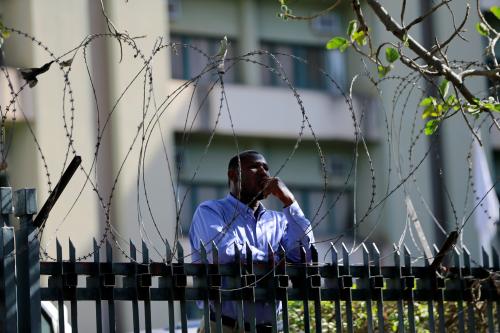 A man looks on from behind a barbed wire during a freedom rally in Abuja, Nigeria December 23, 2019. REUTERS/Afolabi Sotunde