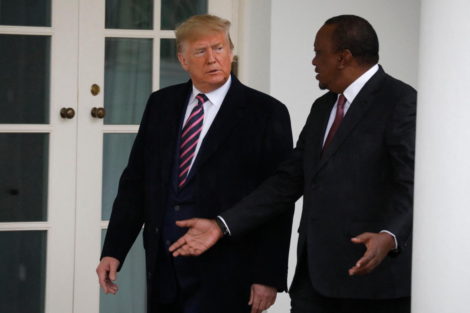 U.S. President Donald Trump points to the media as he walks with Kenyan President Uhuru Kenyatta before their meeting in the Oval Office of the White House in Washington on February 6, 2020. Photo by Yuri Gripas/ABACAPRESS.COM