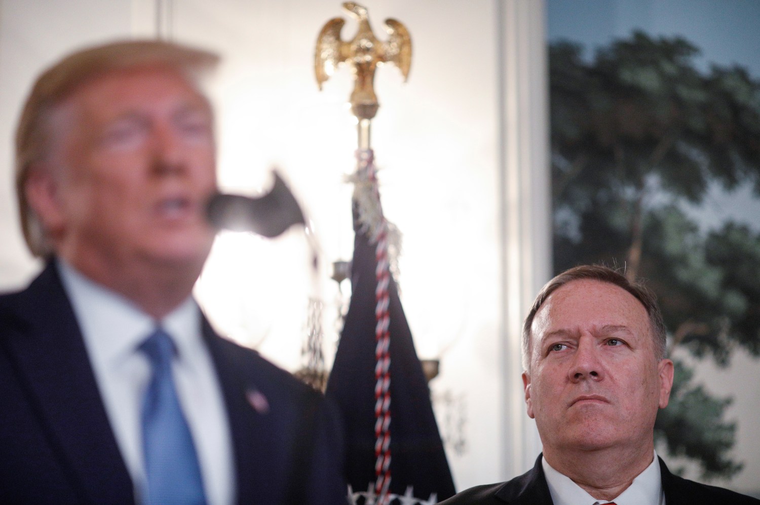 U.S. Secretary of State Mike Pompeo stands by as U.S. President Donald Trump delivers a statement on the conflict in Syria in the Diplomatic Room of the White House in Washington, U.S., October 23, 2019. REUTERS/Tom Brenner