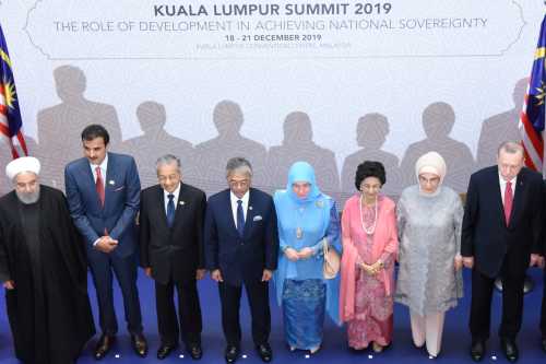 Iranian President Hassan Rouhani, Qatar's Emir Sheikh Tamim bin Hamad Al Thani, Malaysia's Prime Minister Mahathir Mohamad, Malaysia's King Sultan Abdullah Sultan Ahmad Shah, Malaysia's Queen Tunku Azizah Aminah Maimunah Iskandariah, Malaysia's First Lady Siti Hasmah Mohamad Ali, Turkey's First Lady Emine Erdogan and Turkey's President Recep Tayyip Erdogan pose for a photograph during Kuala Lumpur Summit in Kuala Lumpur, Malaysia December 19, 2019. Malaysia Department of Information/Handout via REUTERS ATTENTION EDITORS - THIS IMAGE WAS PROVIDED BY A THIRD PARTY. MANDATORY CREDIT. NO RESALES. NO ARCHIVES.