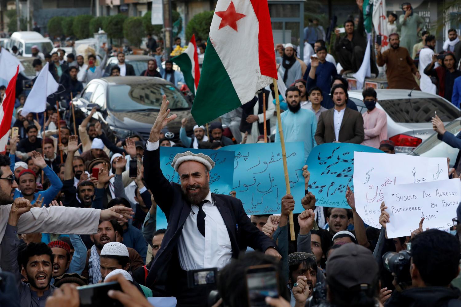 Supporters of Pashtun Tahafuz Movement (PTM) chant slogans as they carry signs and flags during a country-wide protests over the arrest of their leader and student activist Manzoor Pashteen, in Karachi, Pakistan January 28, 2020. REUTERS/Akhtar Soomro