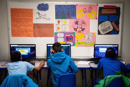 Dec 4, 2019;  Dilley, TX, U.S.A; Young migrants use computers inside a classroom in the U.S. Immigration and Customs Enforcement's (ICE) South Texas Family Residential Center in Dilley, Texas Mandatory Credit: Courtney Sacco-USA TODAY