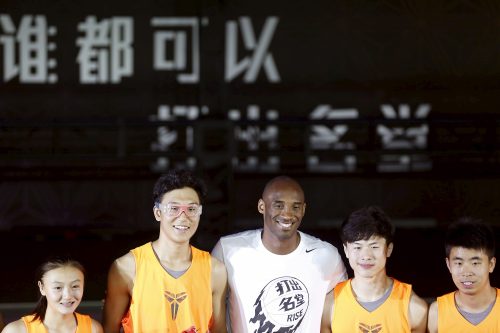 Kobe Bryant (C) of NBA's Los Angeles Lakers attends a promotional event in Shanghai, August 3, 2015. REUTERS/Aly Song