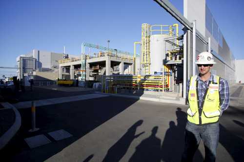 An escort awaits his tour group during tour of the Carlsbad Desalination plant in Carlsbad, California, December 14, 2015. REUTERS/Earnie Grafton