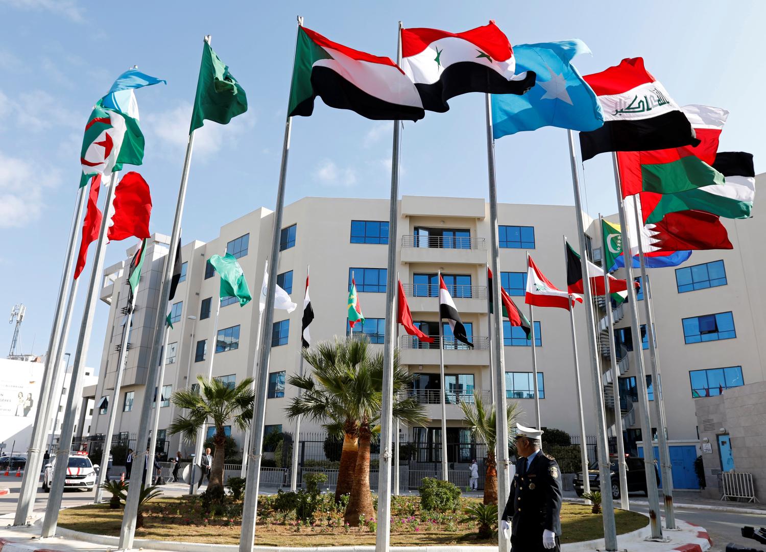 Flags are pictured before a preparatory meeting between Arab foreign ministers ahead of the Arab summit in Tunis, Tunisia March 29, 2019. REUTERS/Zoubeir Souissi