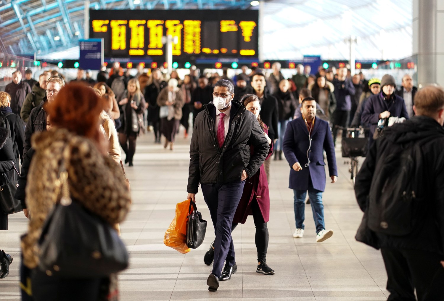 A man is seen wearing a protective face mask at Waterloo station in London, Britain, March 6, 2020. REUTERS/Henry Nicholls