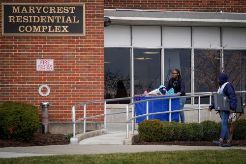 Students cart their belongings out of a dormitory before a deadline to vacate University of Dayton in Ohio on-campus housing due to measures to combat the spread of novel coronavirus, in Dayton, Ohio, U.S. March 11, 2020. REUTERS/Bryan Woolston