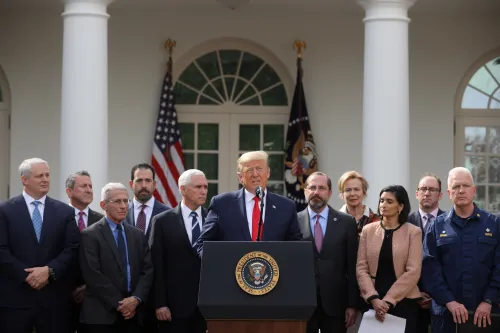 U.S. President Donald Trump declares the coronavirus pandemic a national emergency as Vice President Mike Pence, Health and Human Services Secretary Alex Azar and other officials listen during a news conference in the Rose Garden of the White House in Washington, U.S., March 13, 2020. REUTERS/Jonathan Ernst
