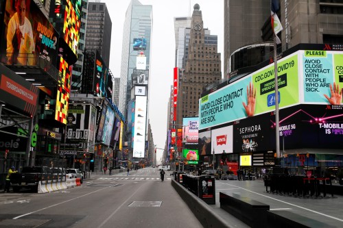 A message about protecting yourself from the coronavirus disease (COVID-19) is seen on an electronic billboard in a nearly empty Times Square in Manhattan in New York City, New York, U.S., March 20, 2020. REUTERS/Mike Segar