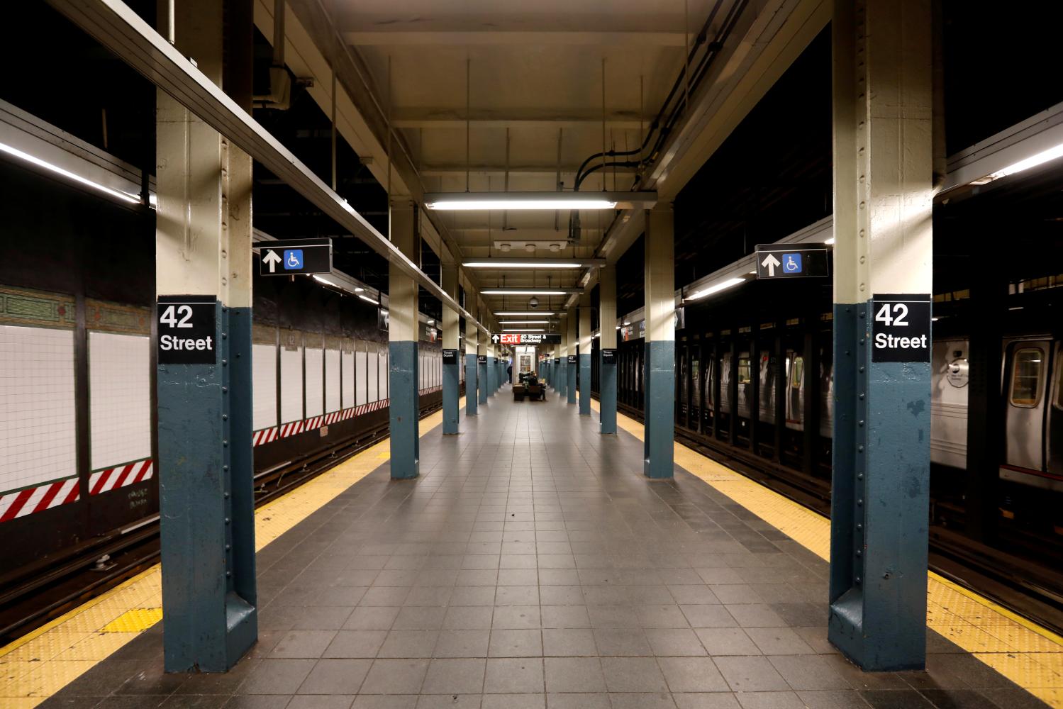 A nearly empty subway platform is seen at the 42nd Street subway station during the coronavirus outbreak in New York City, New York, U.S., March 20, 2020. REUTERS/Mike Segar