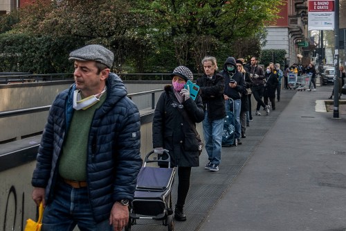 Queues hundreds of meters long to enter the supermarket in Milan, Italy, respecting the anti-COVID-19 safety distance on March 21, 2020.