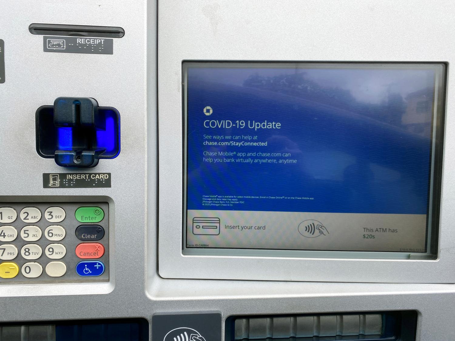 FILE PHOTO: A Chase bank drive-through ATM screen is seen with a COVID-19 message in Santa Monica, California, U.S., amid reports of the coronavirus, March 16, 2020.  REUTERS/Lucy Nicholson/File Photo