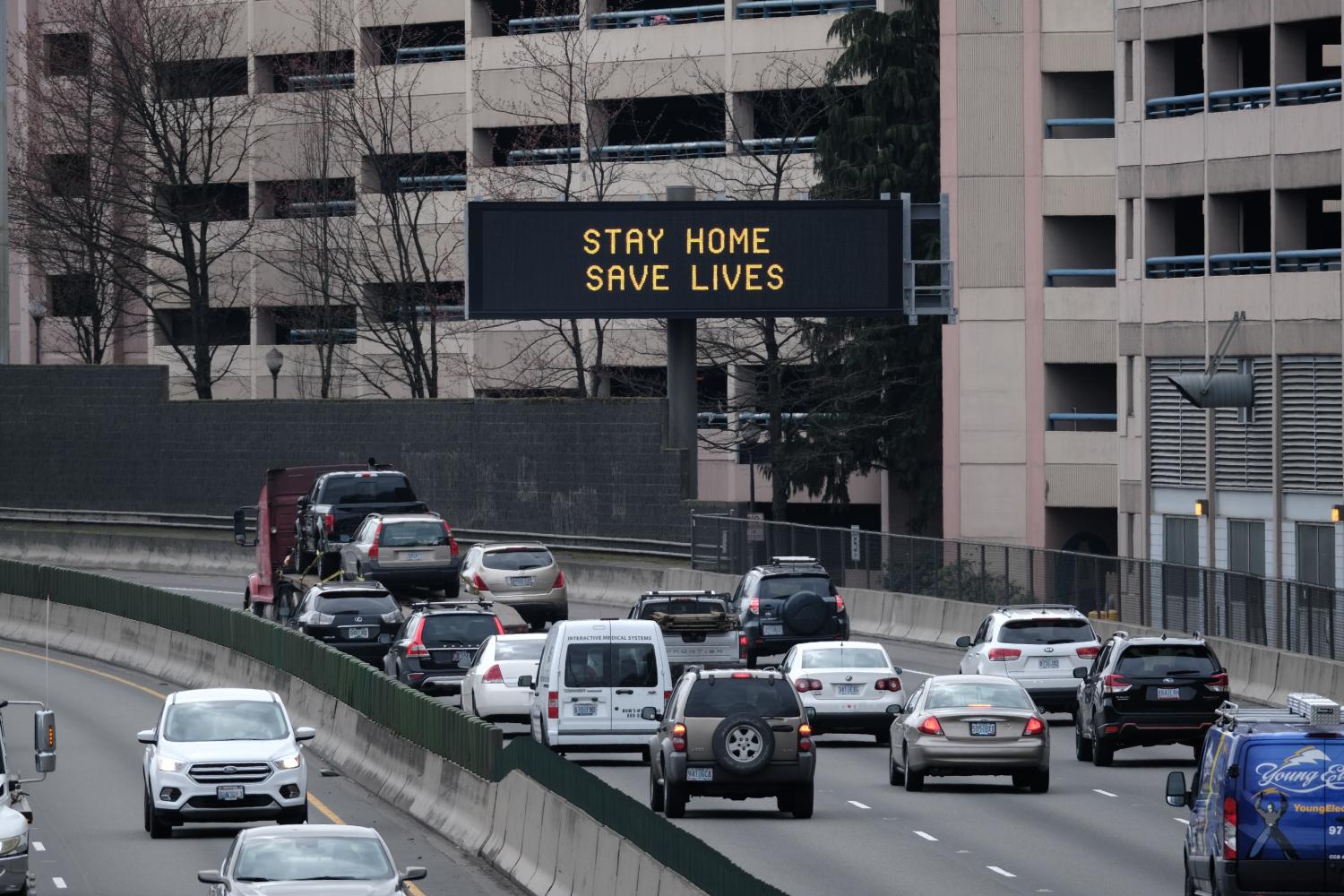 An advisory sign urges motorists to stay home on Interstate 84 near the Providence Medical Center in Portland, Ore., on March 26, 2020. Oregon is enforcing a statewide executive order to stay home except for essential needs as more extreme social distancing measures aim to slow the spread of the novel coronavirus (COVID-19) and flatten the curve. (Photo by Alex Milan Tracy/Sipa USA)No Use UK. No Use Germany.