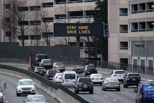 An advisory sign urges motorists to stay home on Interstate 84 near the Providence Medical Center in Portland, Ore., on March 26, 2020. Oregon is enforcing a statewide executive order to stay home except for essential needs as more extreme social distancing measures aim to slow the spread of the novel coronavirus (COVID-19) and flatten the curve. (Photo by Alex Milan Tracy/Sipa USA)No Use UK. No Use Germany.