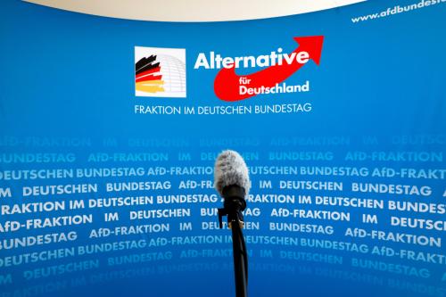 A microphone stands in front of an AfD (Alternative fuer Deutschland) logo on the press wall of the German Bundestag in Berlin, March 12, 2020. REUTERS/Michele Tantussi