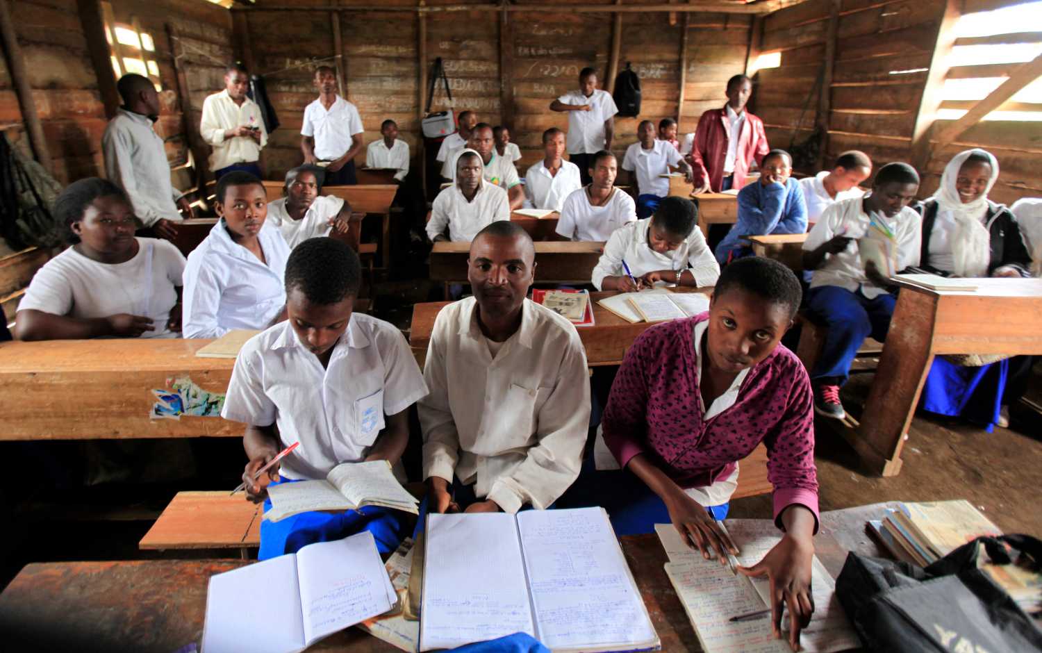 Students attend a lesson in the Democratic Republic of Congo town of Bunagana, an area under the control of M23 rebels fighting government forces in eastern Congo, near the border of Uganda October 19, 2012. REUTERS/James Akena (DEMOCRATIC REPUBLIC OF CONGO - Tags: POLITICS EDUCATION SOCIETY)