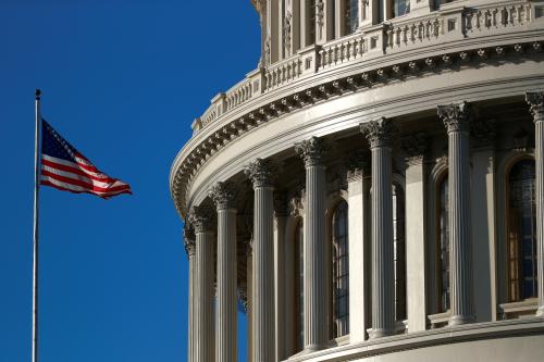 An American flag flies outside of the U.S. Capitol dome ahead of the House of Representatives  resolution appointing managers for the Senate impeachment trial against U.S. President Donald Trump in Washington, U.S., January 15, 2020. REUTERS/Tom Brenner