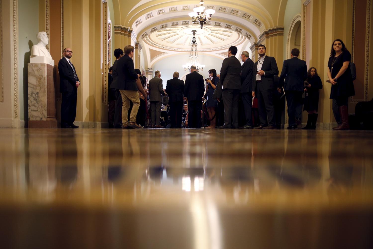 Reporters gather around U.S. Senate Democratic leaders as they talk to reporters during a news conference following a party policy lunch meeting at the U.S. Capitol in Washington, January 20, 2016. Members of the U.S. Congress have been spending fewer days working in Washington since the late 2000s, according to a Reuters review of congressional records going back 18 years. Picture taken January 20, 2016. To match Insight USA-CONGRESS/WORKINGDAYS  REUTERS/Carlos Barria
