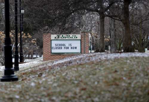 A sign outside Aldo Leopold Schools says, 'School is closed for now' on March 20, 2020, after schools were ordered to close indefinitely due to the coronavirus pandemic.Gpg Greenbaycoronavirustour 031920 Sk30