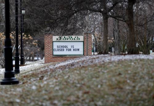 A sign outside Aldo Leopold Schools says, 'School is closed for now' on March 20, 2020, after schools were ordered to close indefinitely due to the coronavirus pandemic.Gpg Greenbaycoronavirustour 031920 Sk30