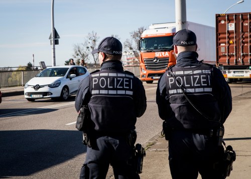 German police officers stand at the French-German border between Kehl and Strasbourg, on March 16, 2020 in Kehl, as part of border control operations. Germany has reintroduced border controls with France, Austria, Switzerland, Luxemburg and Denmark from March 16, 2020 due to the coronavirus crisis, interior minister Horst Seehofer said the day before.