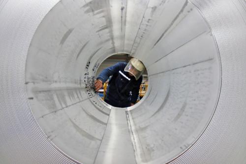 An employee works at the production line of aluminium rolls at a factory in Zouping, Shandong province, China November 23, 2019. Picture taken November 23, 2019. REUTERS/Stringer ATTENTION EDITORS - THIS IMAGE WAS PROVIDED BY A THIRD PARTY. CHINA OUT.