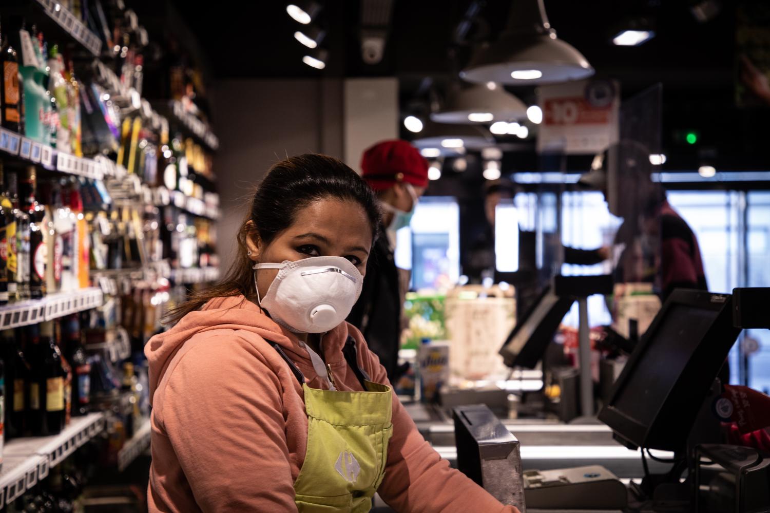 Fahmids keeps on doing her job as a cashier in Paris, wearing a face mask and gloves. A crystal panel has been installed to separate her from costumers.