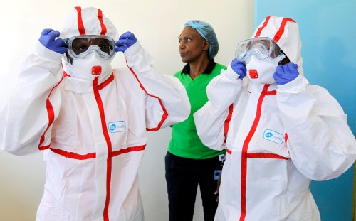 FILE PHOTO: Kenyan nurses wear protective gear during a demonstration of preparations for any potential coronavirus cases at the Mbagathi Hospital, isolation centre for the disease, in Nairobi, Kenya March 6, 2020. REUTERS/Njeri Mwangi/File Photo