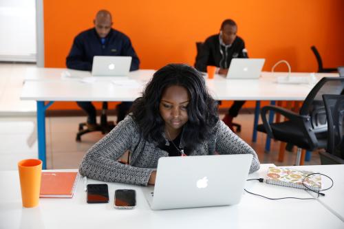 An employee of tech start-up Sendy, which offers online logistics services, works on her computer at their office in Nairobi, Kenya, October 30, 2018. Picture taken October 30, 2018. REUTERS/Baz Ratner