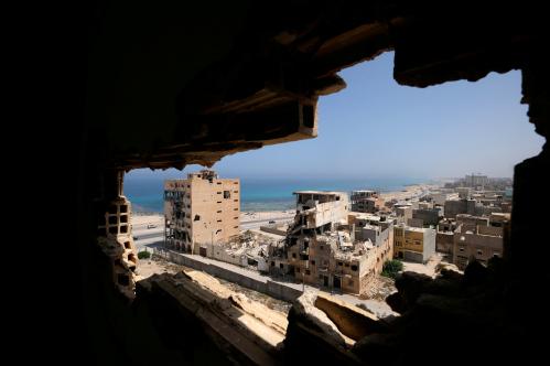 Destroyed buildings are seen through a hole in Benghazi lighthouse after it was severely damaged by years of armed conflict, in Benghazi, Libya July 10, 2019 . Picture taken July 10, 2019.  REUTERS/Esam Omran Al-Fetori     TPX IMAGES OF THE DAY