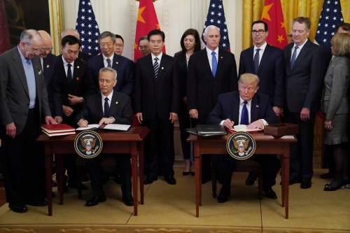 Chinese Vice Premier Liu He and U.S. President Donald Trump sign "phase one" of the U.S.-China trade agreement during a ceremony in the East Room of the White House in Washington, U.S., January 15, 2020. REUTERS/Kevin Lamarque
