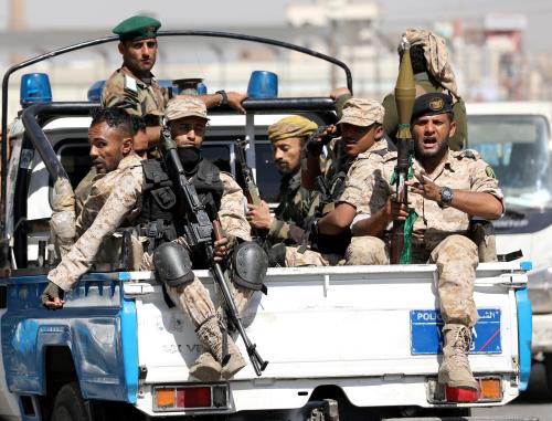FILE PHOTO: Houthi troops ride on the back of a police patrol truck after participating in a Houthi gathering in Sanaa, Yemen February 19, 2020. REUTERS/Khaled Abdullah/File Photo