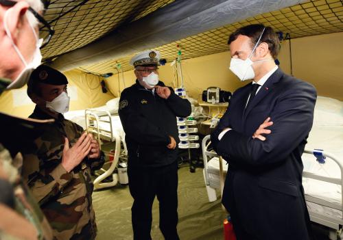 French President Emmanuel Macron wearing face masks during the visit of the military field hospital outside the Emile Muller Hospital in Mulhouse, eastern France, on March 25, 2020, on the tenth day of a strict lockdown in France to stop the spread of COVID-19. Photo by Mathieu Cugnot/Pool/ABACAPRESS.COM