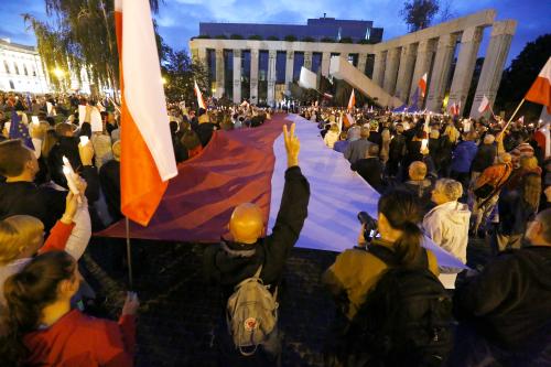 People gather next to the Supreme Court during the "Chain of the lights" candlelit protest against judicial reforms in Warsaw, Poland July 25, 2017. REUTERS/Kacper Pempel